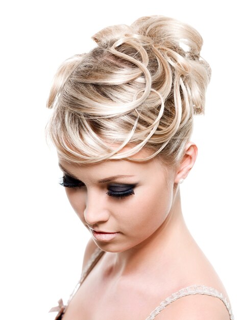 Creative fashion hairstyle on the blond long female hair