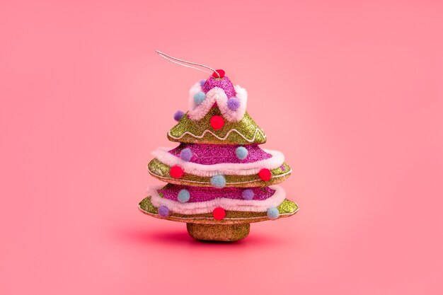 creative layout with a christmas tree on a bright pink