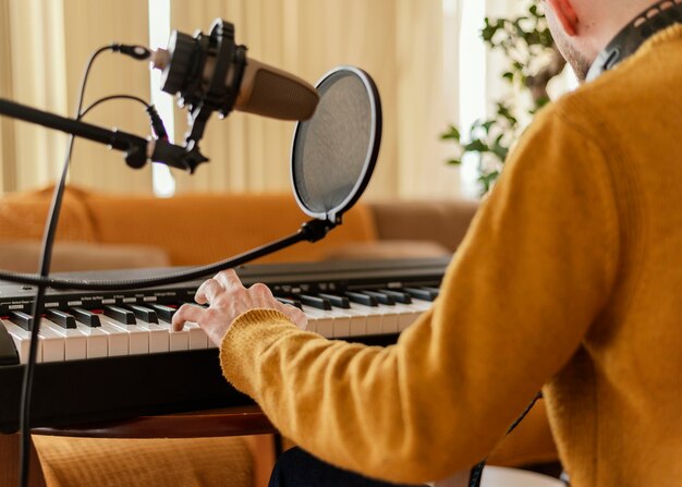 Creative man practicing a song at home