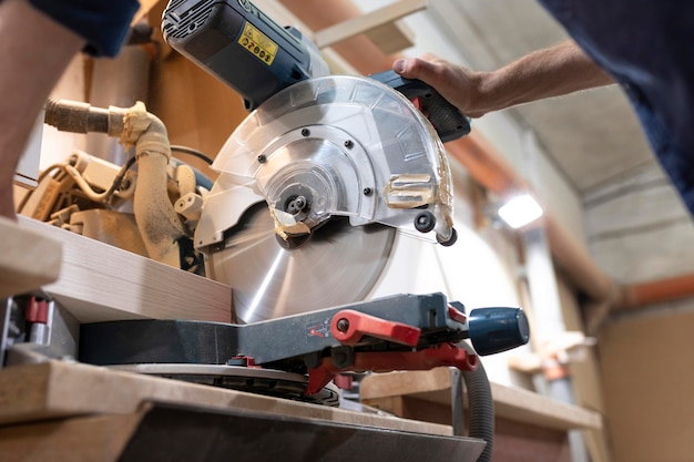 Creative man working in a wood workshop