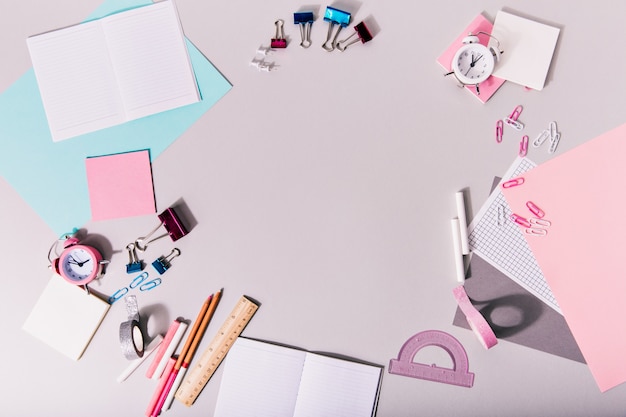 Creative mess on table with office supplies