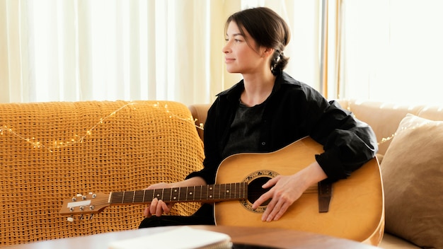 Free photo creative musician practicing indoors