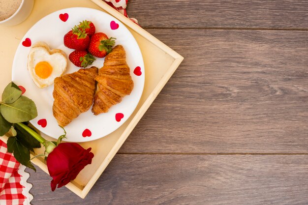 Creative romantic breakfast on tray