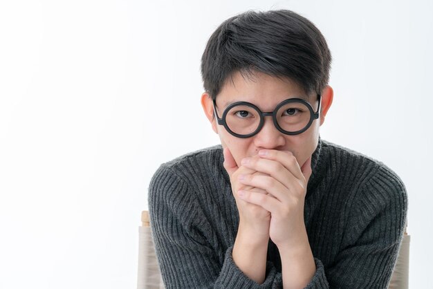 Creative smart asian male with glasses facial emotional portrait with happiness and confident feeling white background