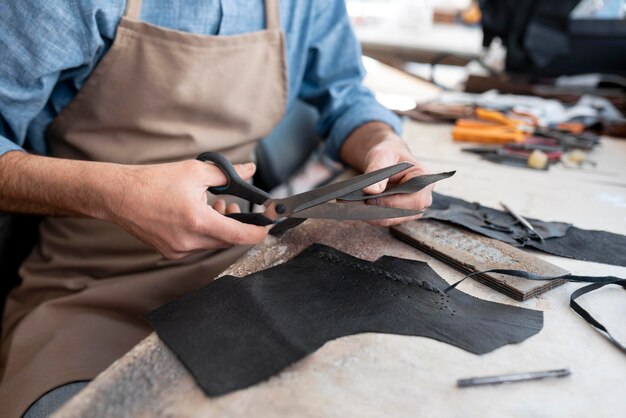 Creative tailor working in workshop on a new cloth