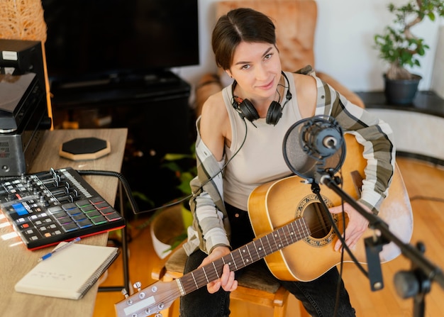 Creative woman practicing a song at home