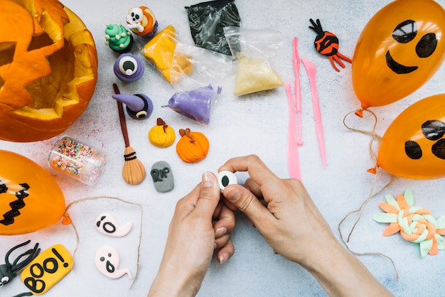 Creative workplace with plasticine and Halloween figures