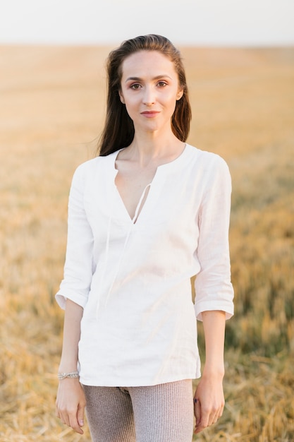 Creative young woman posing in the nature