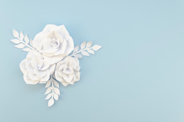 Creativity concept with white flowers on blue background