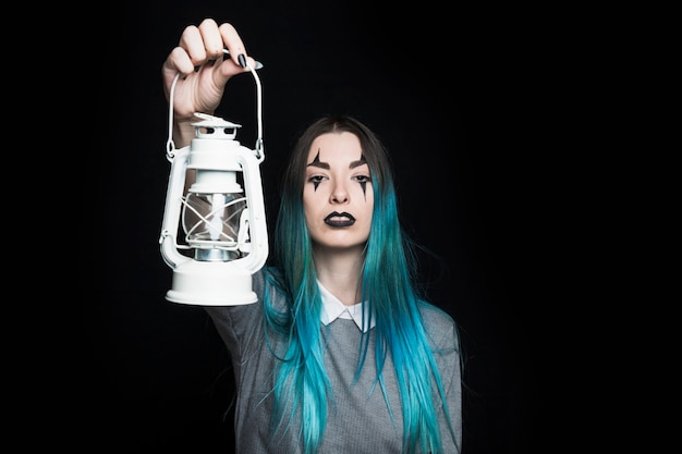Creepy young female with lantern