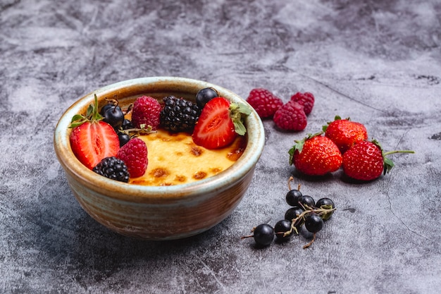 Creme brulee garnished with berries