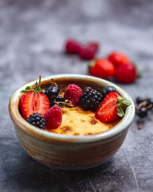 Creme brulee garnished with berries
