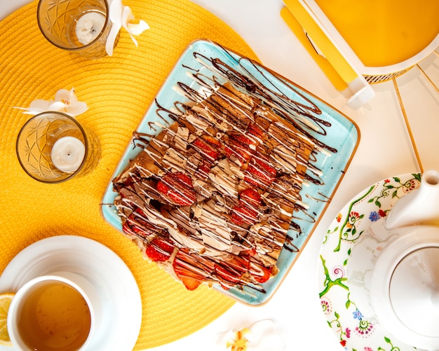 Free photo crepes with fruits  banana and strawberry  top view