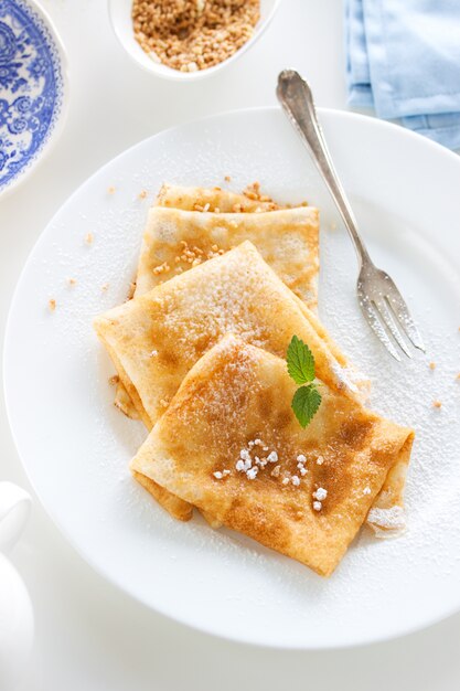 Crepes with icing sugar