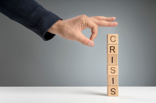Crisis mesage on wooden blocks