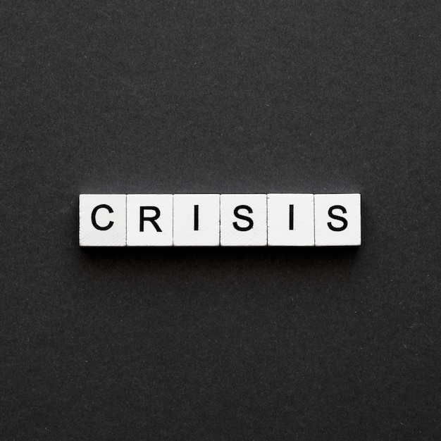 crisis word written on wooden cubes