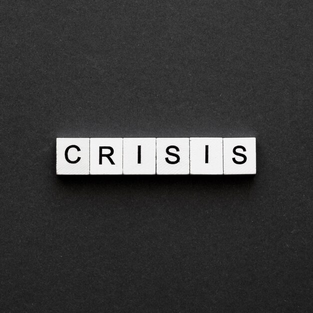 Crisis word written on wooden cubes