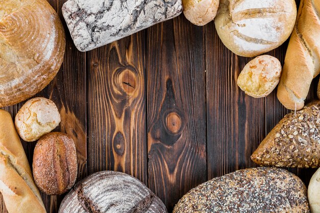 Crisp tasty bread frame on wooden backdrop