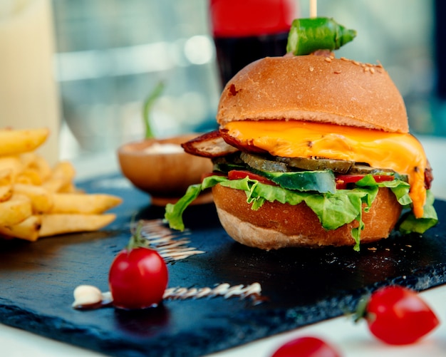 Crispy chicken cheeseburger and french fries