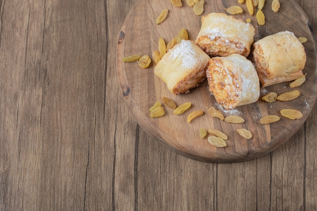 Crispy cooked roll cookies with stuffing on a wooden board.