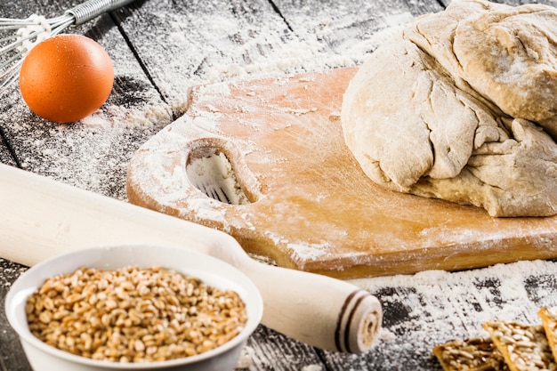 Crispy cookies ingredients with flour on wooden flour