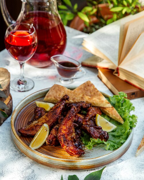 Crispy fried chicken and lemon wedges