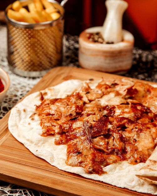 Crispy fried pieces of meat on pita bread