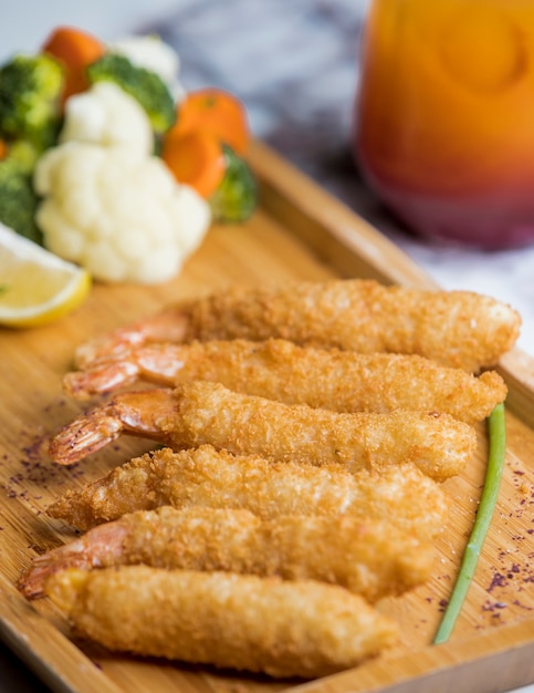 crispy fried shrimps served with boiled vegetables