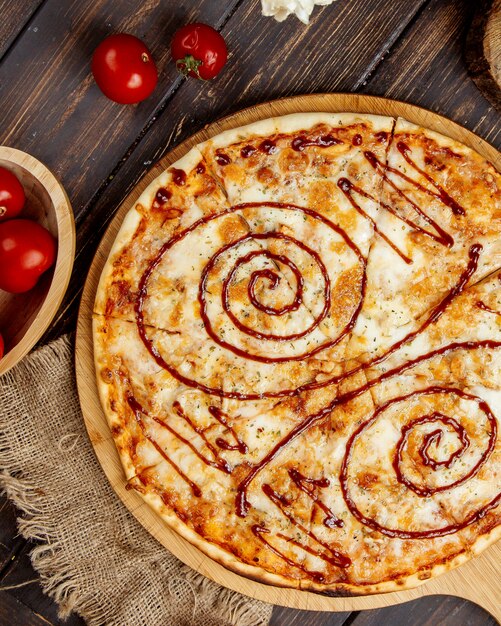 Crispy pizza with cheese and barbecue sauce