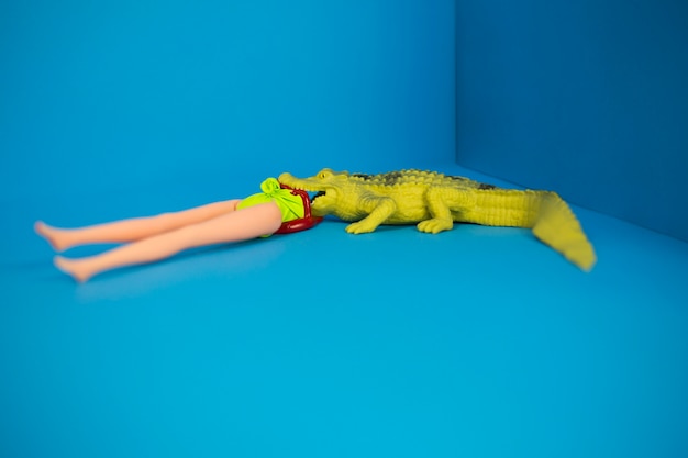 Free photo crocodile and doll