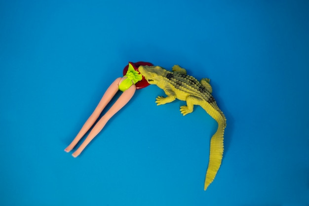 Free photo crocodile eating doll body