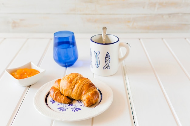 Croissant and coffee for breakfast