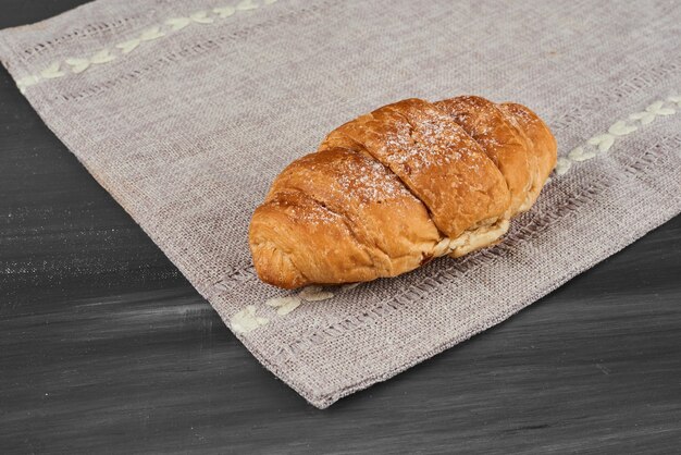 Croissant on a kitchen towel. 