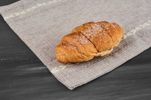 Croissant on a kitchen towel. 