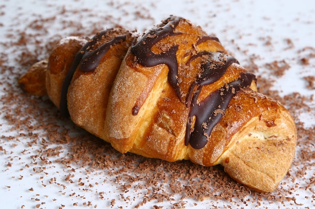 Free photo croissant with grated chocolate