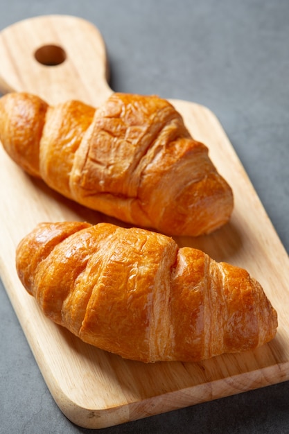 Croissants on black background.