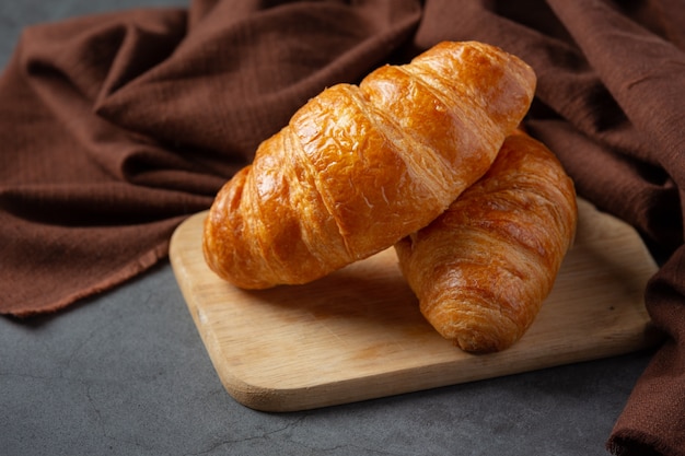 Free photo croissants on black surface.