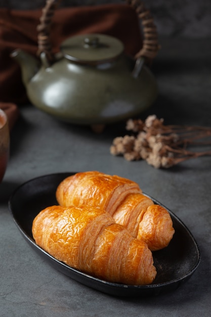 Free photo croissants on black surface.