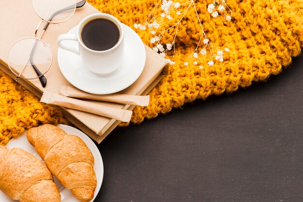 Croissants and coffee on table