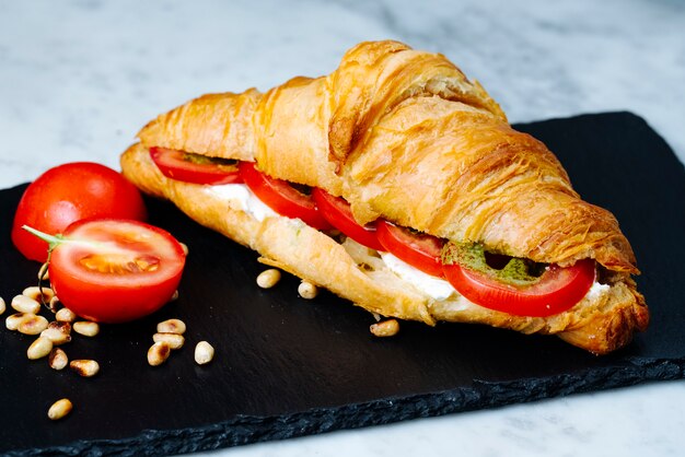 Croissants filled with tomato and white cheese
