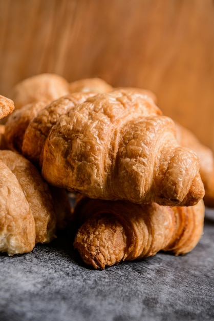  croissants on grey table.