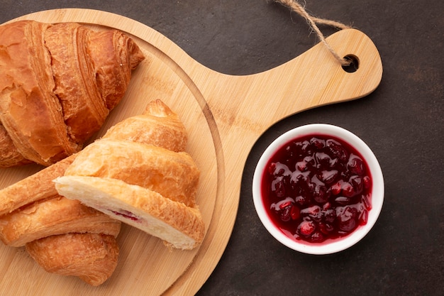 Croissants and sweet jam flat lay