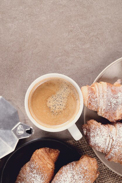 Croissants with coffee cup