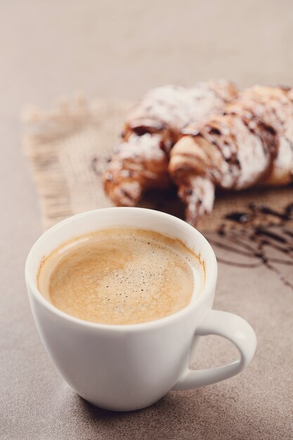 Croissants with coffee cup