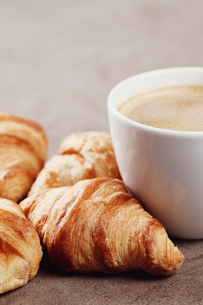 Croissants with coffee cup