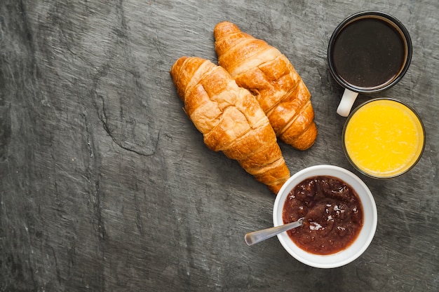 Croissants with jam and drinks