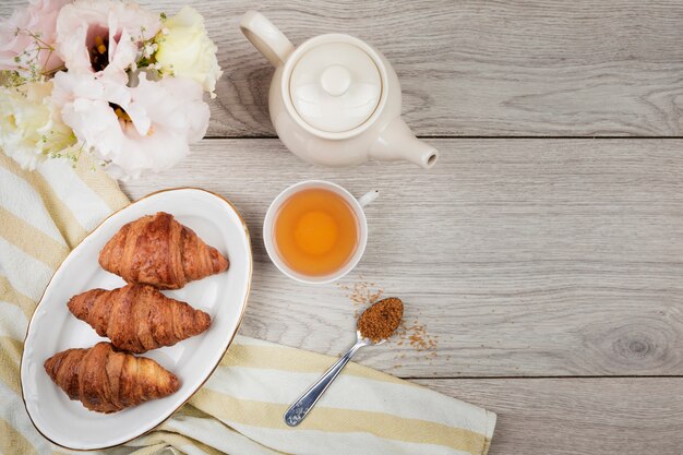 Croissants on wooden background