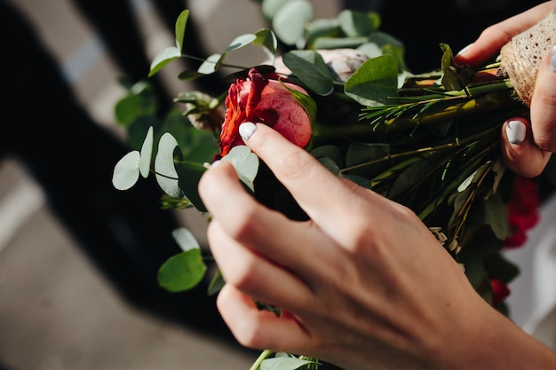 Crop bride holding bouquet