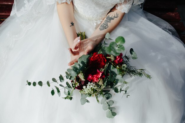 Crop bride with bouquet