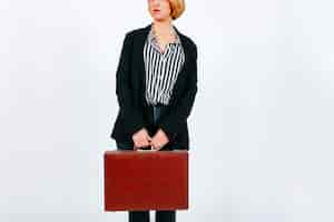 Free photo crop businesswoman with suitcase